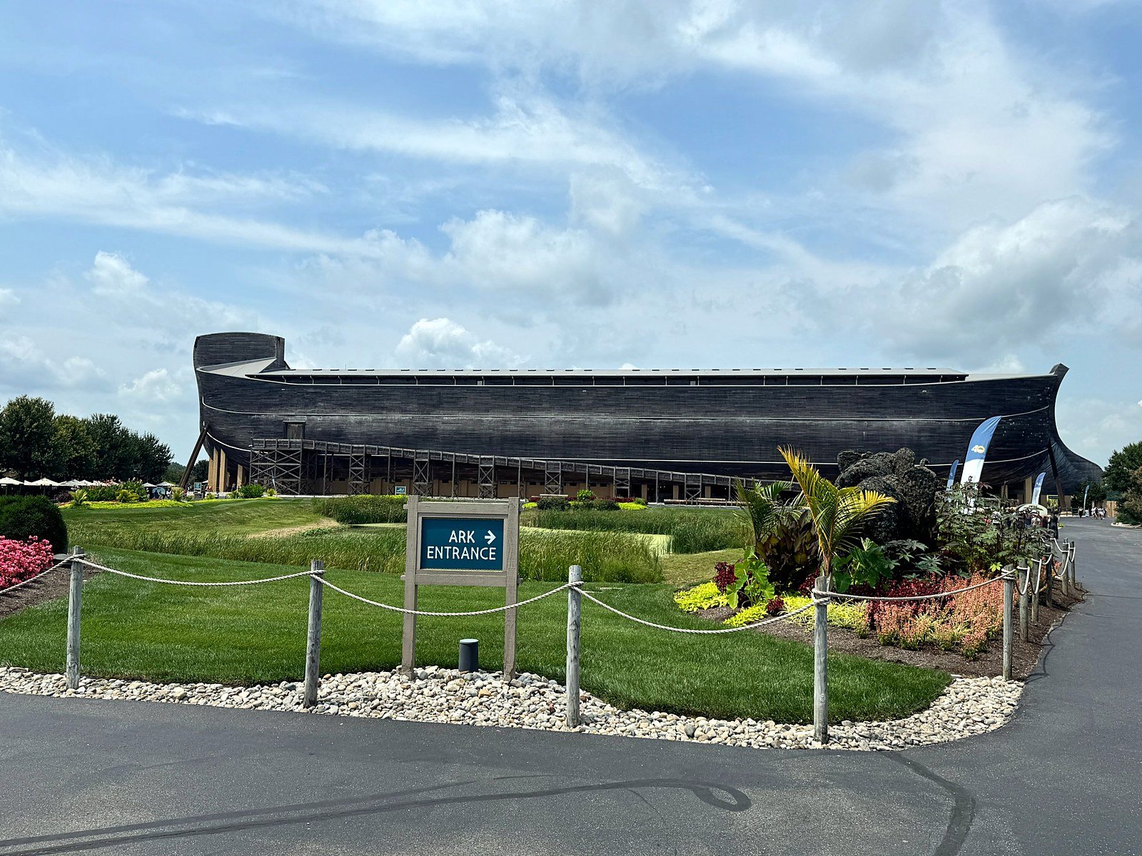 Ark Entrance sign and landscaped walkway leading toward the Ark Encounter