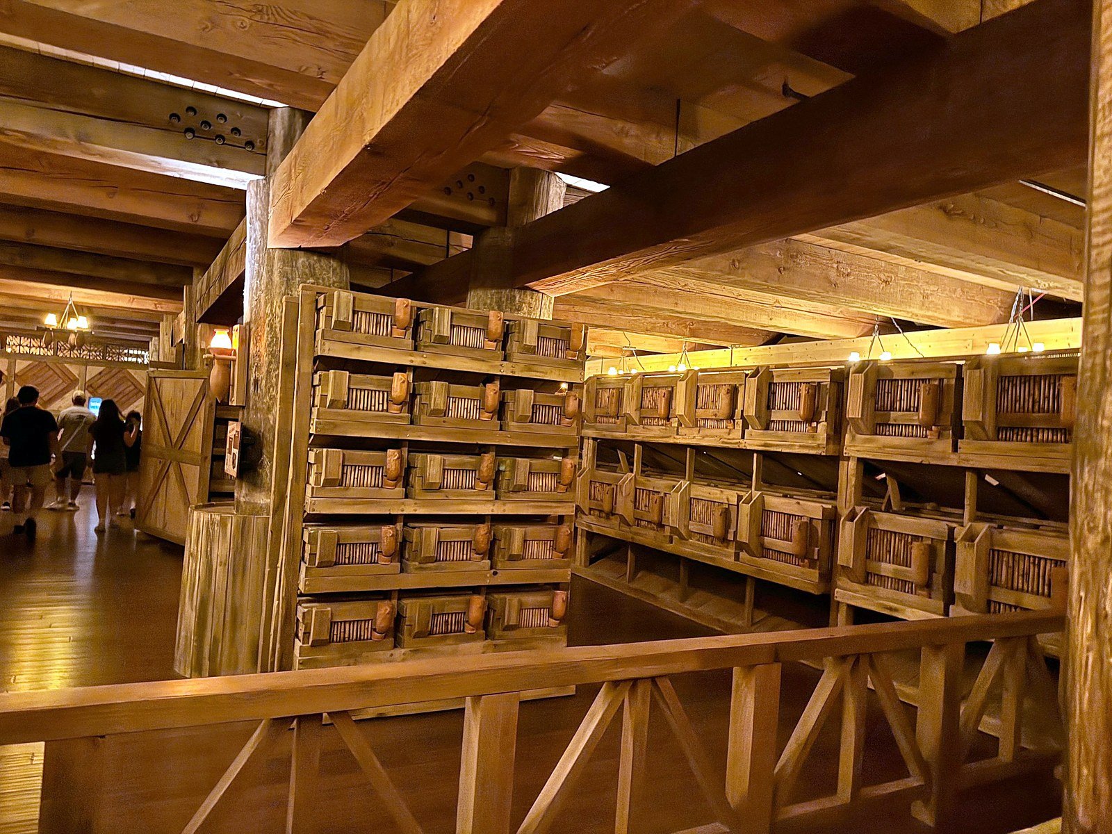 Lower deck of the Ark Encounter with wooden railings and animal stalls