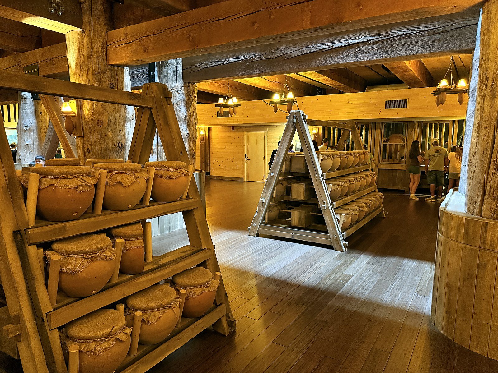 Rolling wooden racks of clay food and water storage jars inside the Ark Encounter